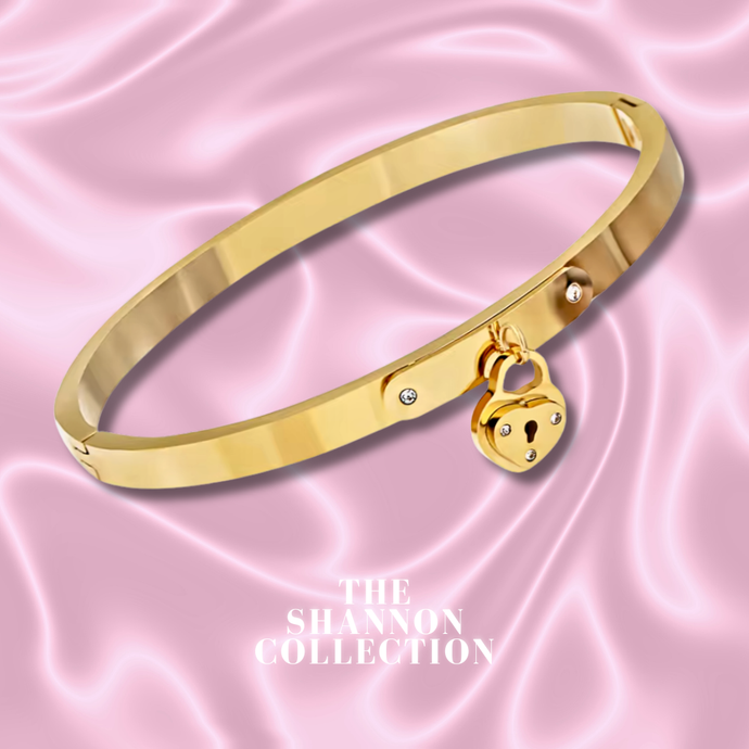 'HEART KEEPER’ 18K GOLD PLATED STAINLESS STEEL BANGLE